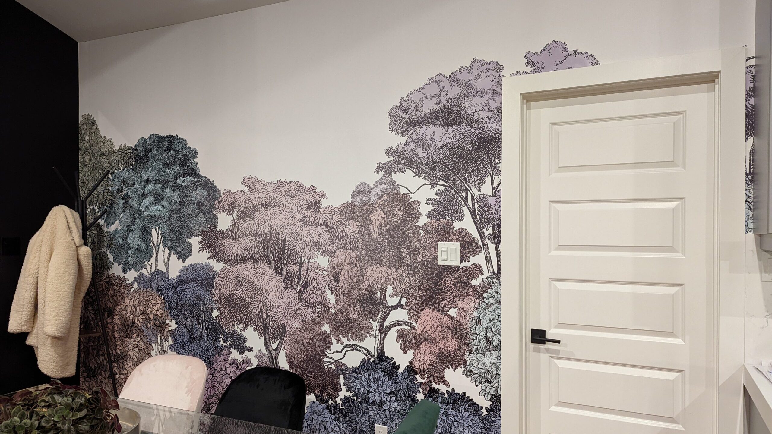 A beautiful wallpaper mural installed by Peridot Designs in London Ontario, featuring violet-hued trees as an interior lobby wall. 